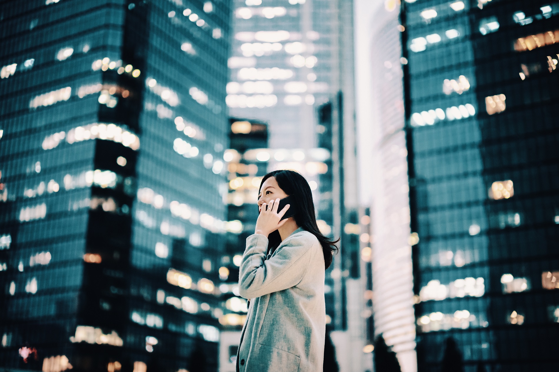 Business professional in a modern city environment representing digital transformation, data-driven solutions, and enterprise technology services.